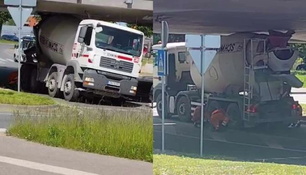 Изображение к статье: Очередной водитель тяжёлой техники переоценил габариты и застрял под мостом