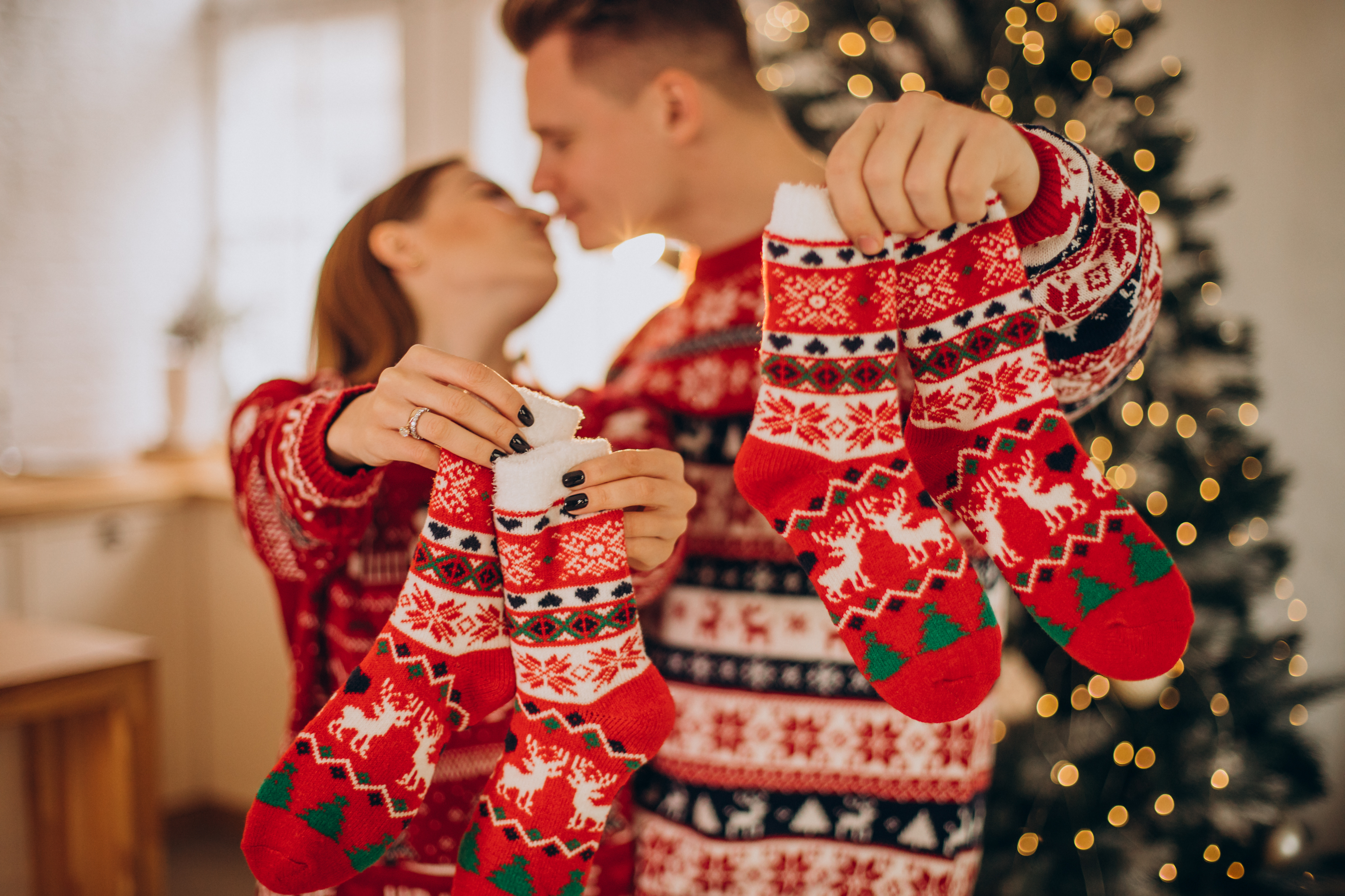 couple-wearing-christmas-sweaters-together.jpg